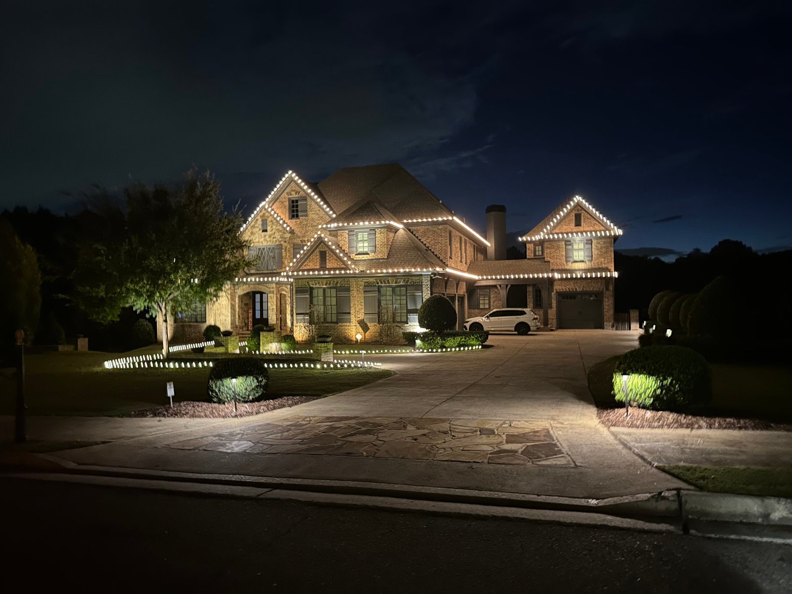 Large North Atlanta home illuminated by Red Clay